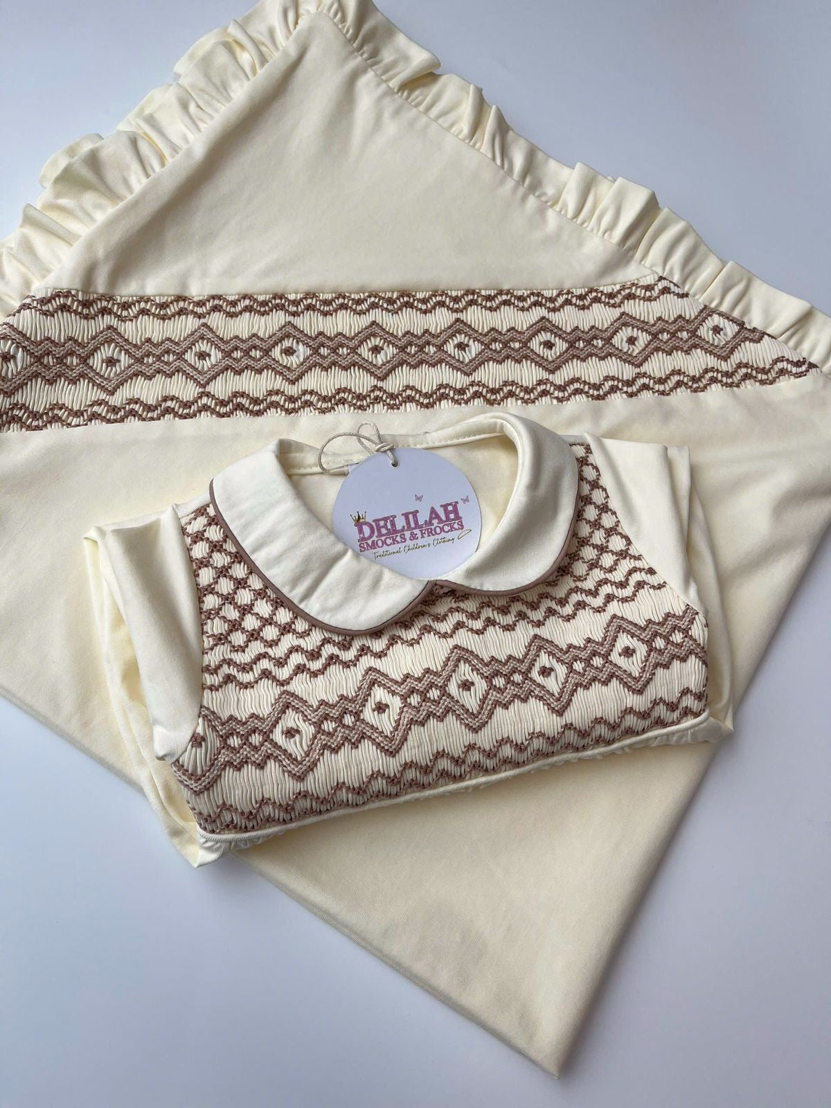 Cream smocked Babygrow set