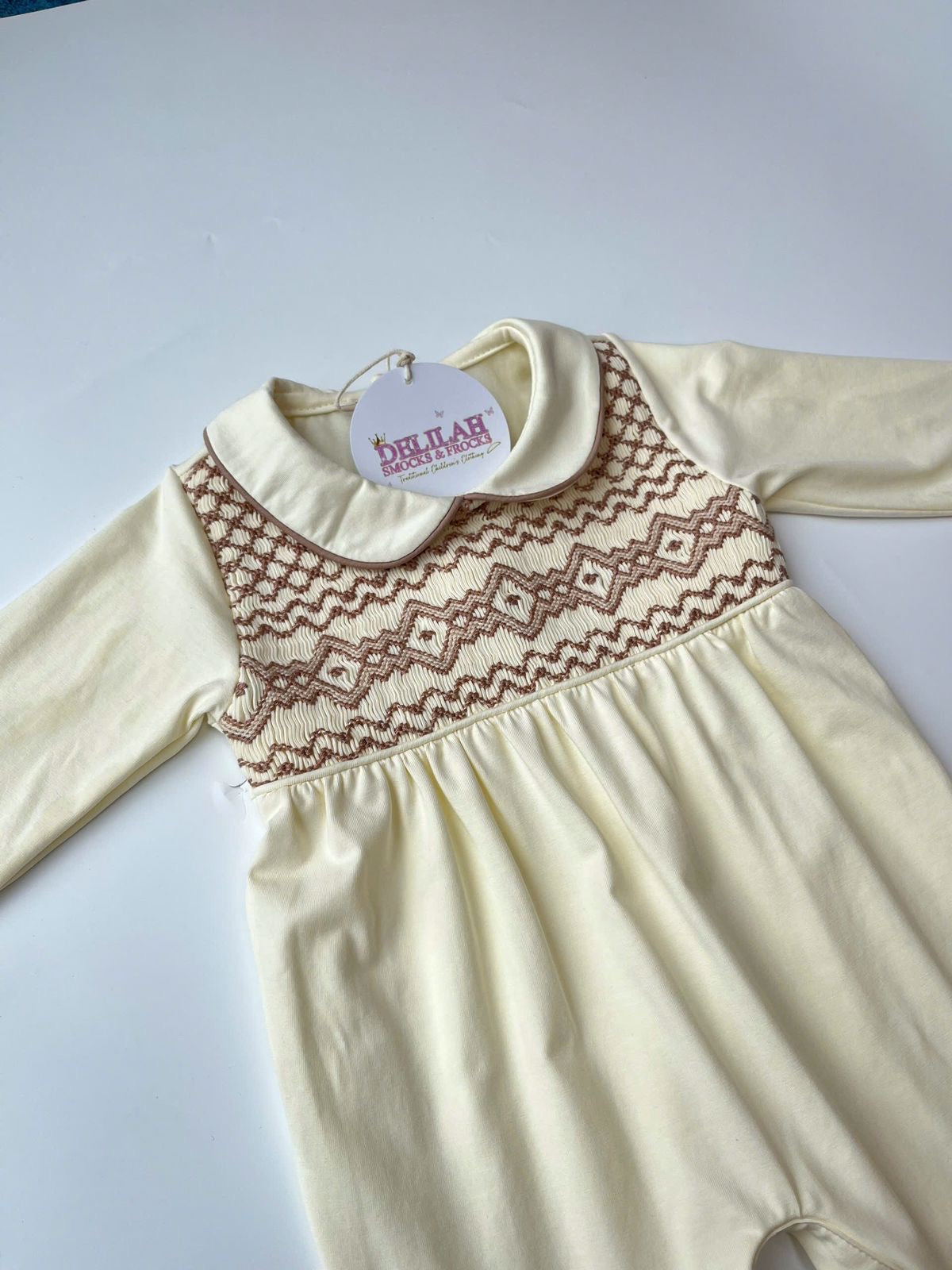 Cream smocked Babygrow set
