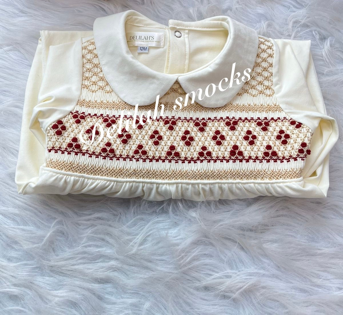 Boys smocked baby grow